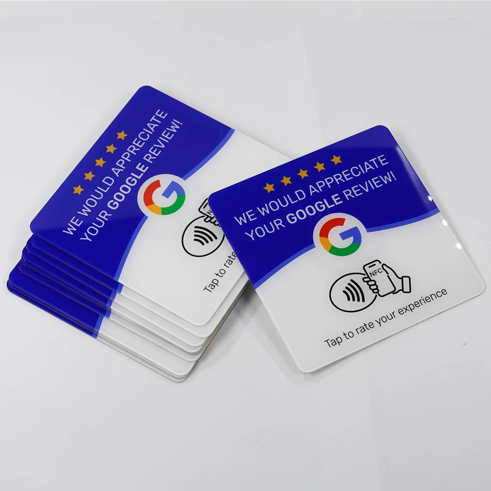 A stack of finished acrylic NFC review plaques